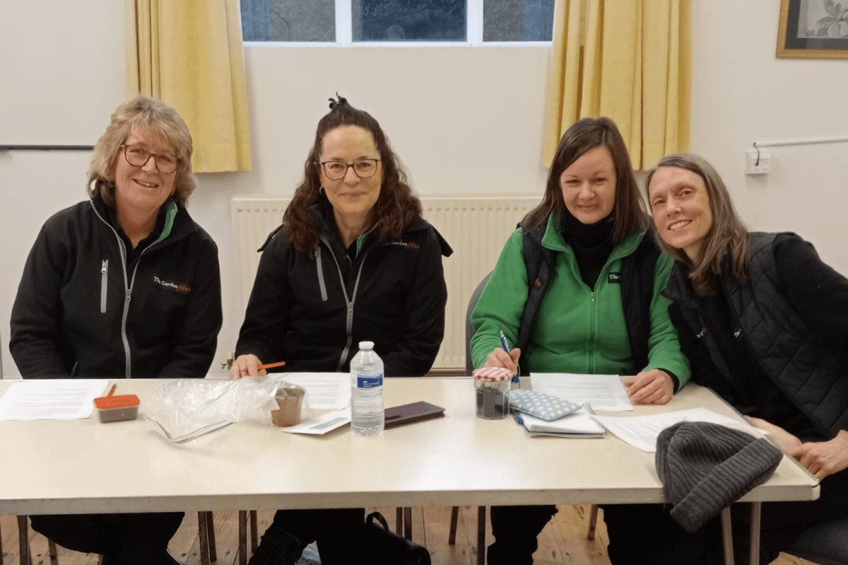 Four people sat at a table