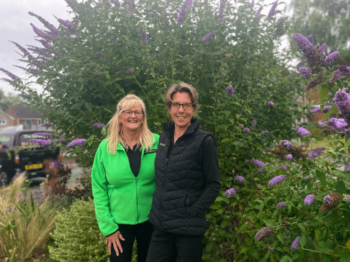 People posing in a garden